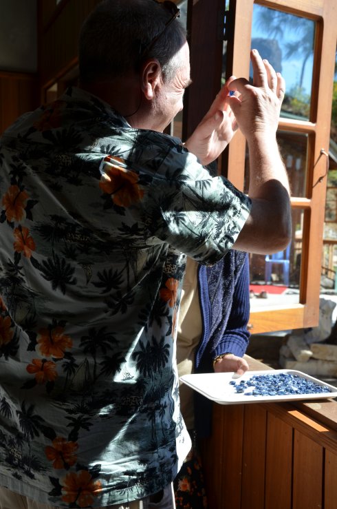 examining blue sapphire crystals